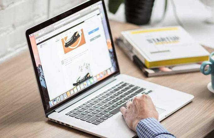 Laptop showing a WordPress website on a workspace desk